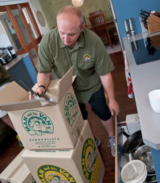 Man and His Van removalist packing household goods in a Sydney home.
