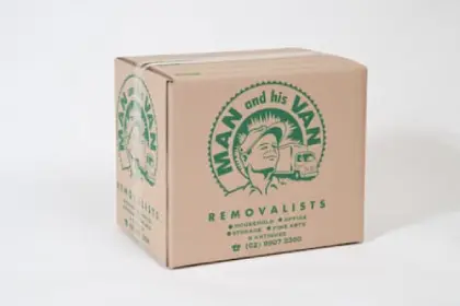Cardboard moving box with Man and His Van branding