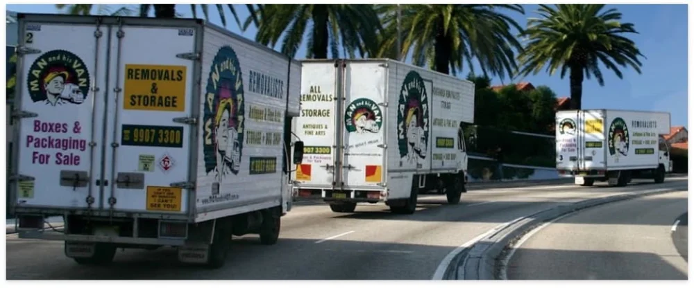 A line of Man and His Van moving trucks on a Sydney road, providing local and interstate relocation services.