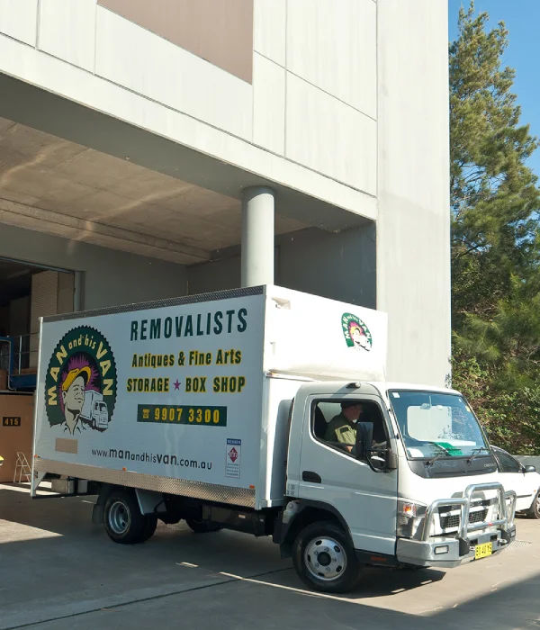 Man and His Van office removalists providing efficient business relocation services at a modern Sydney commercial office block.