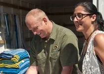 Man and His Van team discussing a move plan with a customer, representing over 30 years of Sydney moving industry experience.