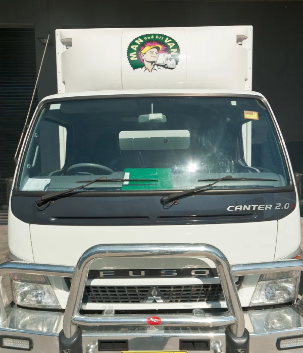 A clean and well-maintained Man and His Van box truck, equipped for secure residential furniture removals in Sydney.