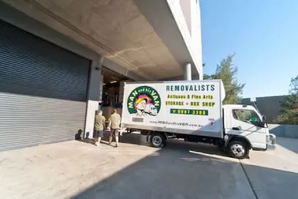 A line of Man and His Van interstate moving vans prepared for professional furniture transport across Australia.