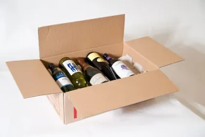 Wine bottles packed in a cardboard box with protective dividers
