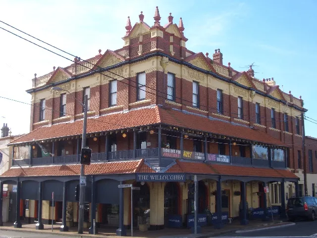 Historic Willoughby Hotel with decorative brickwork, tiled awnings and wraparound balconies